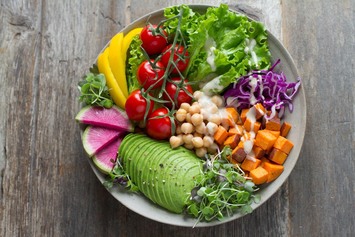 Colourful healthy meal bowl with fresh vegetables and grains